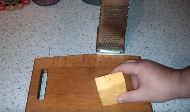 Grate hard cheese.